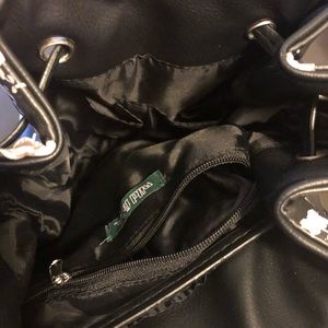 Purple/white flower black backpack.